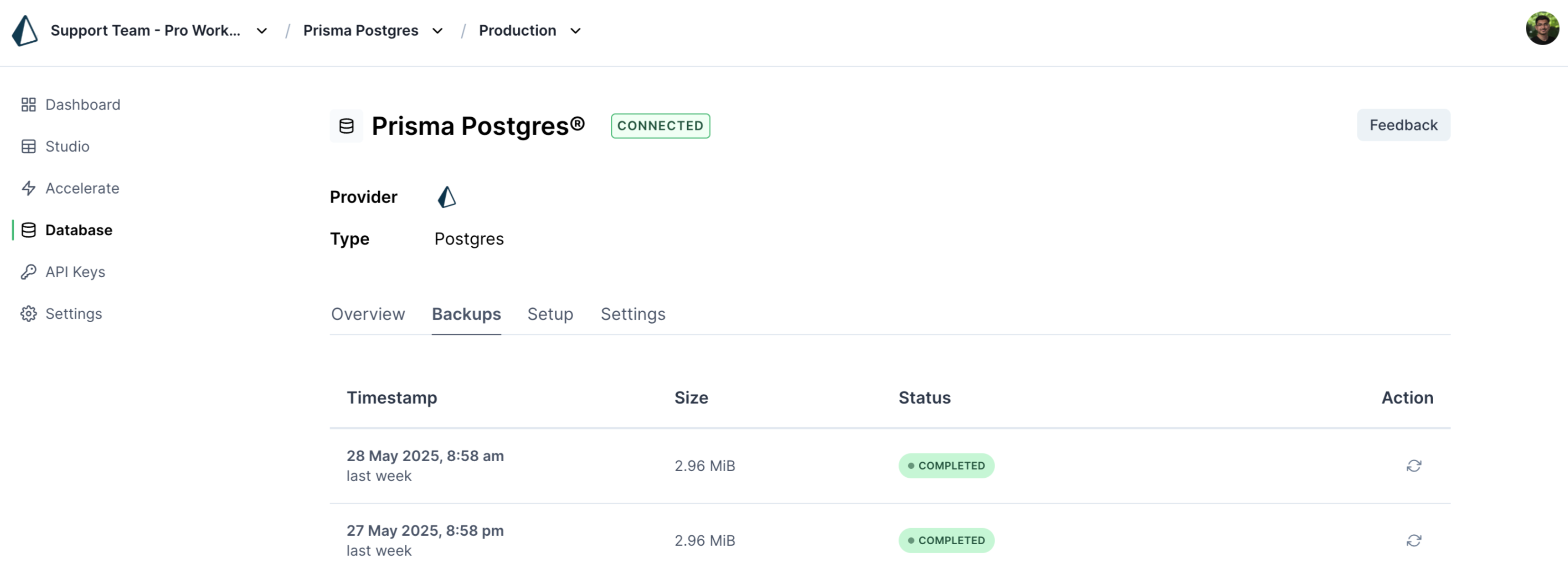 Prisma Console interface showing the backup tab for a Prisma Postgres database instance, with options to view and restore completed backup snapshots.